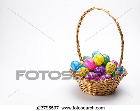 Basket Of Colorful Easter Eggs View Large Photo Image Stock Photo - Basket Of Colorful Easter Eggs. Fotosearch