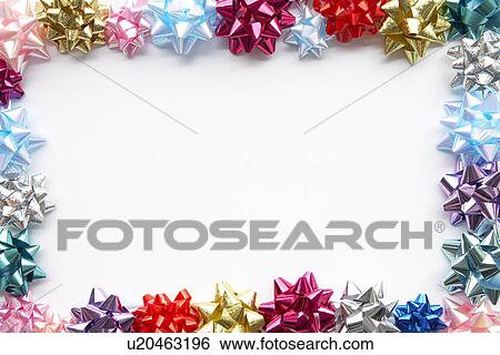 Stock Photograph - Border Made From Colourful Gift Bows Against White Background. Fotosearch