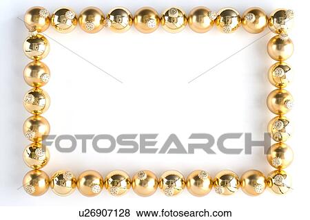 Stock Photo - Border Made From Gold Baubles Against White Background. Fotosearch