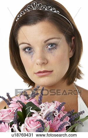 Stock Image - Bride Holding Bouquet And Crying. Fotosearch