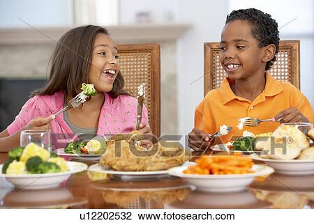 Brother And Sister Having Lunch Together At Home View Large Photo Image Stock Image - Brother And Sister Having Lunch Together At Home. Fotosearch
