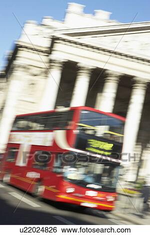 Stock Photograph - Bus Driving Past Royal Exchange. Fotosearch
