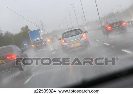 Cars Driving On A Rain Slicked Highway View Large Photo Image Picture - Cars Driving On A Rain Slicked Highway. Fotosearch