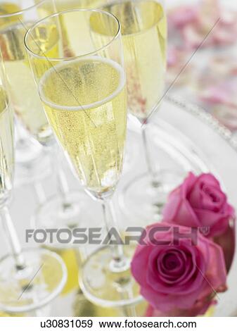 Stock Photo - Champagne Glasses On A Silver Platter. Fotosearch
