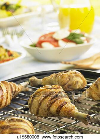 Chicken Cooking On A Grill View Large Photo Image Stock Photo - Chicken Cooking On A Grill. Fotosearch