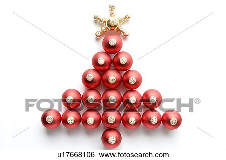 Stock Photograph - Christmas Tree Made From Baubles Against White Background. Fotosearch