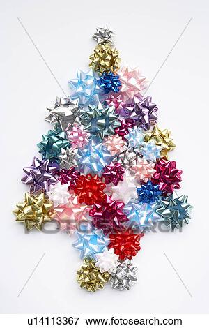 Stock Photo - Christmas Tree Made From Gift Bows Against White Background. Fotosearch