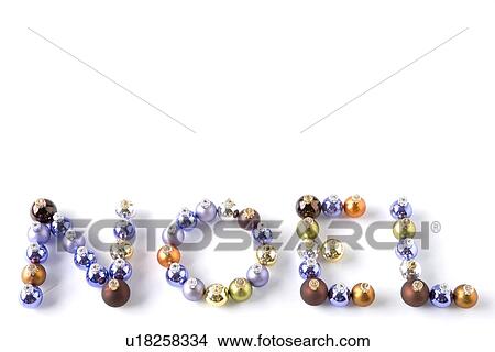 Picture - Coloured Baubles Spelling Out Word Noel Against White Background. Fotosearch