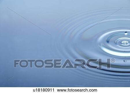 Stock Image - Concentric Circles Forming In Still Water. Fotosearch