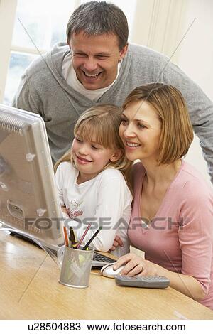 Couple And Daughter Using Computer View Large Photo Image Stock Image - Couple And Daughter Using Computer. Fotosearch