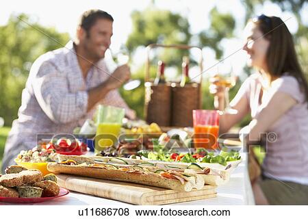 Stock Photo - Couple Dining Al Fresco. Fotosearch