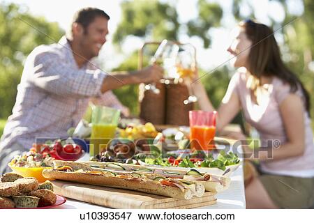 Couple Dining Al Fresco, Toasting Each Other View Large Photo Image Stock Photo - Couple Dining Al Fresco, Toasting Each Other. Fotosearch