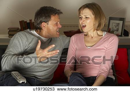 Couple Discussing Choice Of Television Channel View Large Photo Image Stock Image - Couple Discussing Choice Of Television Channel. Fotosearch