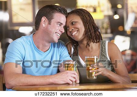 Couple Drinking Beer Together In A Pub View Large Photo Image Stock Image - Couple Drinking Beer Together In A Pub. Fotosearch