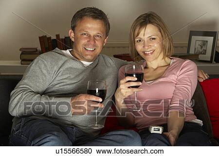 Couple Drinking Wine And Watching Television View Large Photo Image Stock Image - Couple Drinking Wine And Watching Television. Fotosearch