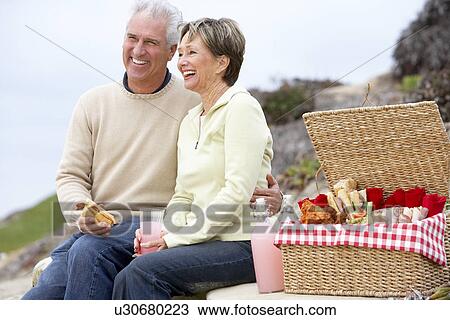 Couple Eating An Al Fresco Meal At The Beach View Large Photo Image Stock Image - Couple Eating An Al Fresco Meal At The Beach. Fotosearch