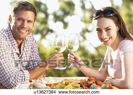 Picture - Couple Eating An Al Fresco Meal. Fotosearch