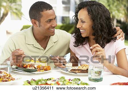 Stock Image - Couple Eating An Al Fresco Meal. Fotosearch