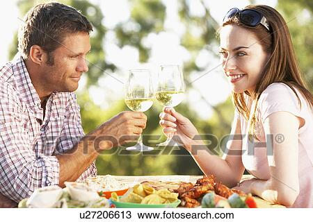 Stock Image - Couple Eating An Al Fresco Meal. Fotosearch