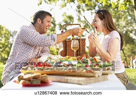 Stock Photo - Couple Eating An Al Fresco Meal. Fotosearch