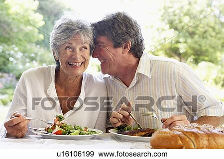 Stock Photo - Couple Eating An Al Fresco Meal. Fotosearch