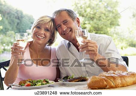 Stock Photo - Couple Eating An Al Fresco Meal. Fotosearch