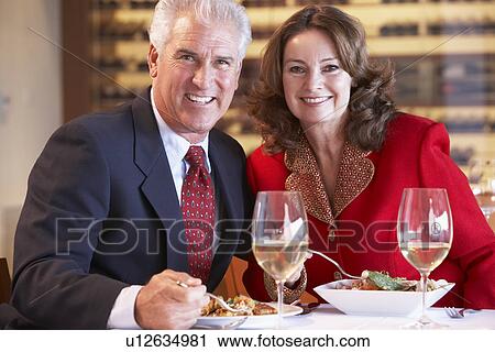 Couple Eating Dinner At A Restaurant View Large Photo Image Stock Image - Couple Eating Dinner At A Restaurant. Fotosearch