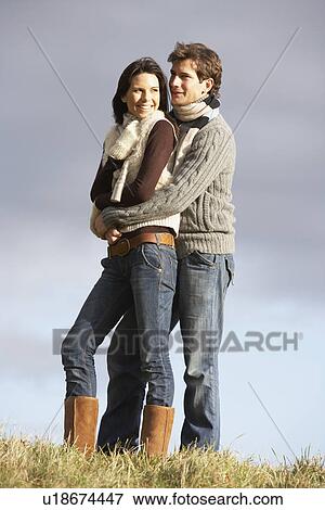 Couple Embracing In Park View Large Photo Image Stock Photo - Couple Embracing In Park. Fotosearch