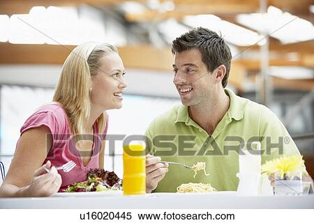 Stock Photography - Couple Having Lunch At The Mall. Fotosearch