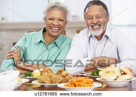 Stock Photography - Couple Having Lunch Together At Home. Fotosearch