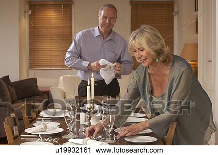 Couple Preparing Table For A Dinner Party View Large Photo Image Stock Image - Couple Preparing Table For A Dinner Party. Fotosearch
