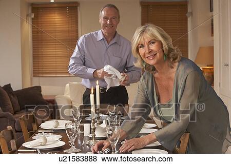 Couple Preparing Table For A Dinner Party View Large Photo Image Stock Photo - Couple Preparing Table For A Dinner Party. Fotosearch