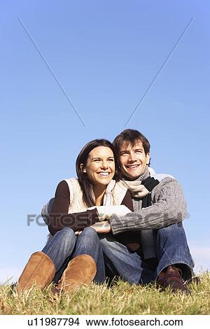 Couple Sitting In Park Together View Large Photo Image Picture - Couple Sitting In Park Together. Fotosearch