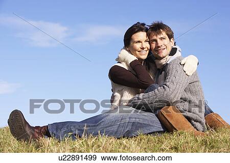 Couple Sitting In Park Together View Large Photo Image Stock Photo - Couple Sitting In Park Together. Fotosearch