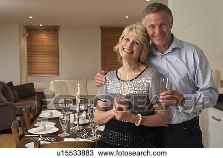 Couple Throwing A Dinner Party View Large Photo Image Stock Image - Couple Throwing A Dinner Party. Fotosearch