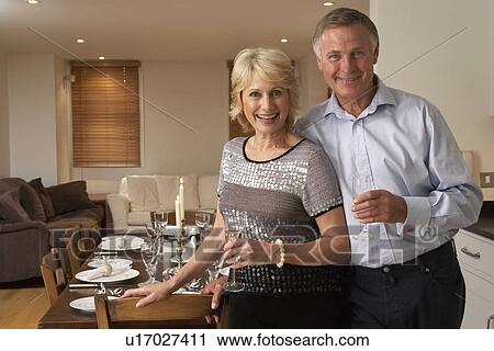 Couple Throwing A Dinner Party View Large Photo Image Stock Image - Couple Throwing A Dinner Party. Fotosearch