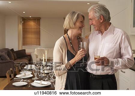Couple Throwing A Dinner Party View Large Photo Image Stock Photograph - Couple Throwing A Dinner Party. Fotosearch