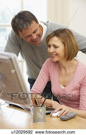 Stock Image - Couple Using Computer. Fotosearch