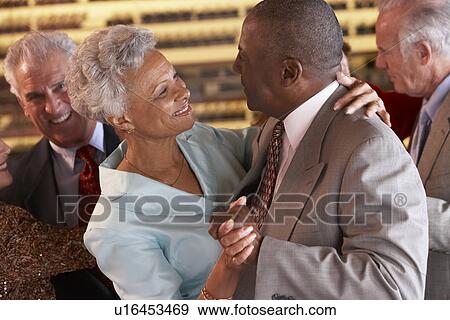 Stock Photo - Couples Dancing Together At A Nightclub. Fotosearch