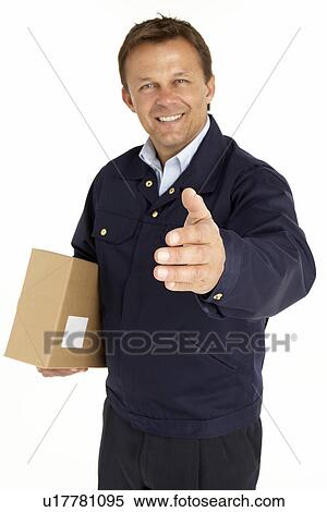 Courier Extending His Hand For A Handshake And Holding A Parcel View Large Photo Image Stock Photography - Courier Extending His Hand For A Handshake And Holding A Parcel. Fotosearch