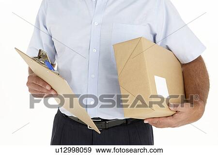 Stock Photo - Courier Holding A Parcel And Clipboard. Fotosearch