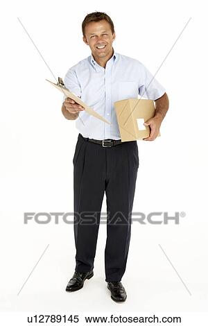 Stock Photography - Courier Holding A Parcel And Clipboard. Fotosearch