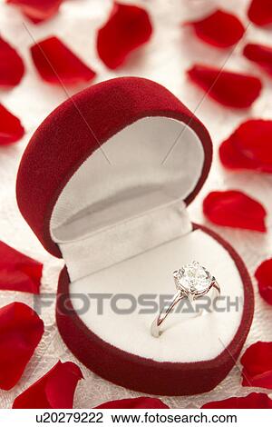 Diamond Ring In Heart Shaped Box Surrounded By Rose Petals View Large Photo Image Stock Image - Diamond Ring In Heart Shaped Box Surrounded By Rose Petals. Fotosearch