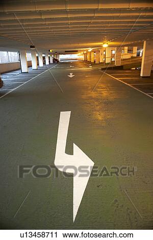 Stock Image - Directional Arrow In A Carpark Building. Fotosearch