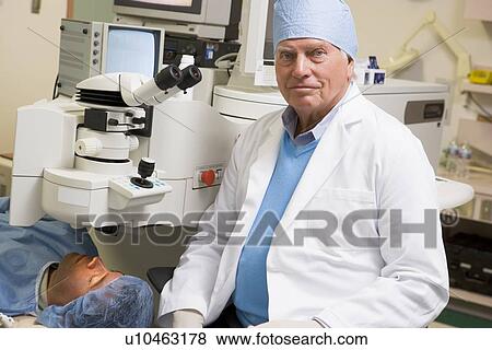 Doctor And Patient About To Undergo Eye Exam View Large Photo Image Stock Photo - Doctor And Patient About To Undergo Eye Exam. Fotosearch