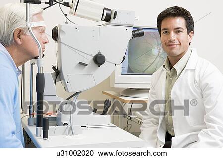 Stock Image - Doctor And Patient Ready For An Eye Exam. Fotosearch