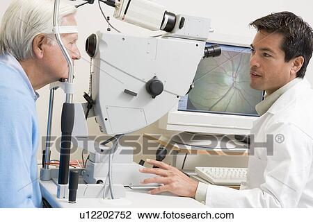 Doctor Checking Patient's Eyes View Large Photo Image Stock Image - Doctor Checking Patient's Eyes. Fotosearch