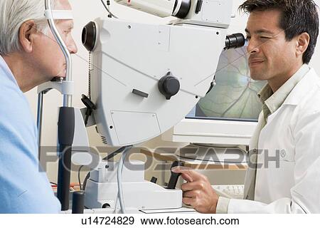Stock Photo - Doctor Checking Patient's Eyes. Fotosearch
