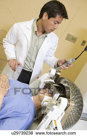 Stock Photo - Doctor Checking Patient's Eyes. Fotosearch