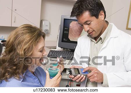 Doctor Performing Check-Up On Patient View Large Photo Image Stock Image - Doctor Performing Check-Up On Patient. Fotosearch